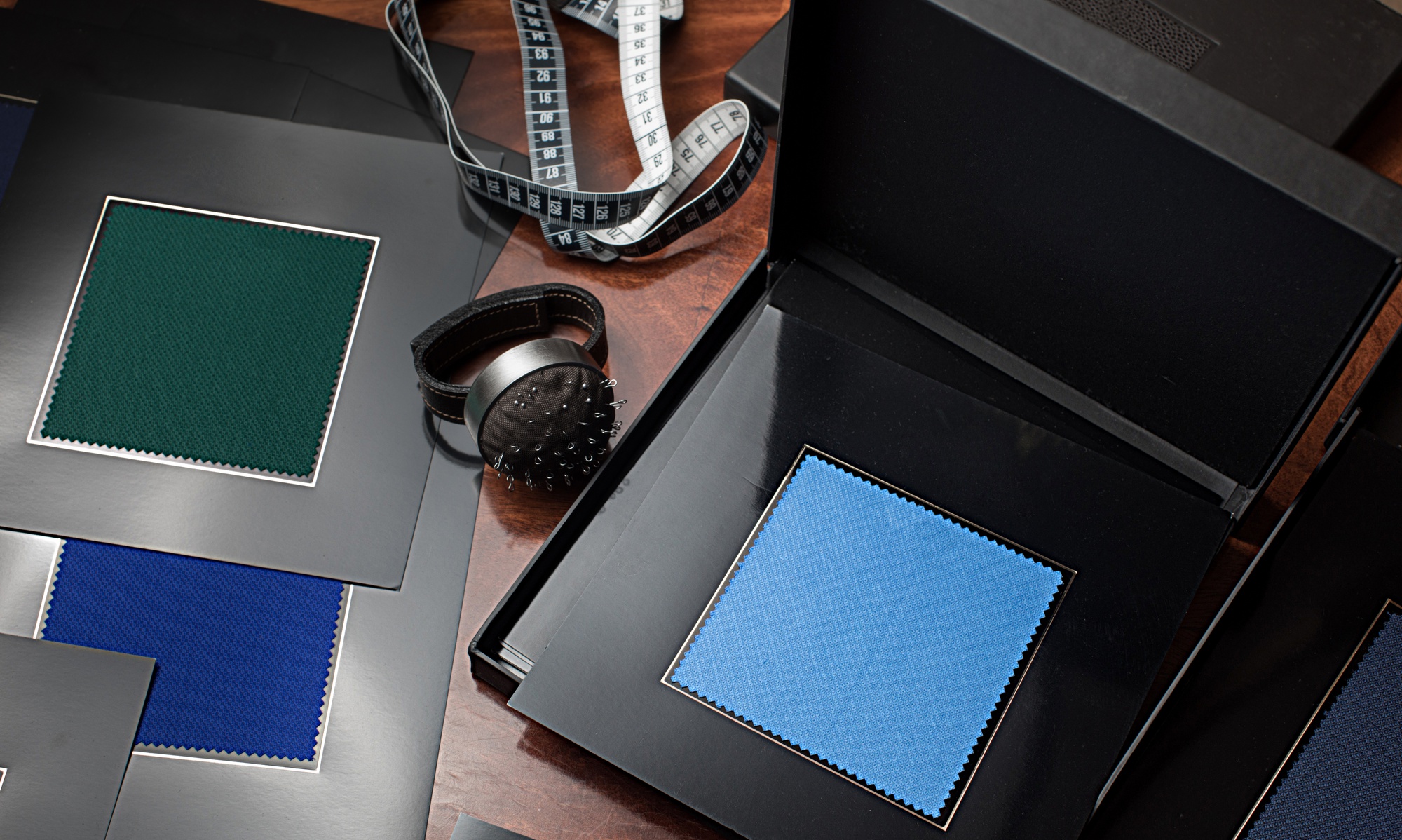 Studio workspace with monitors and sample swatches